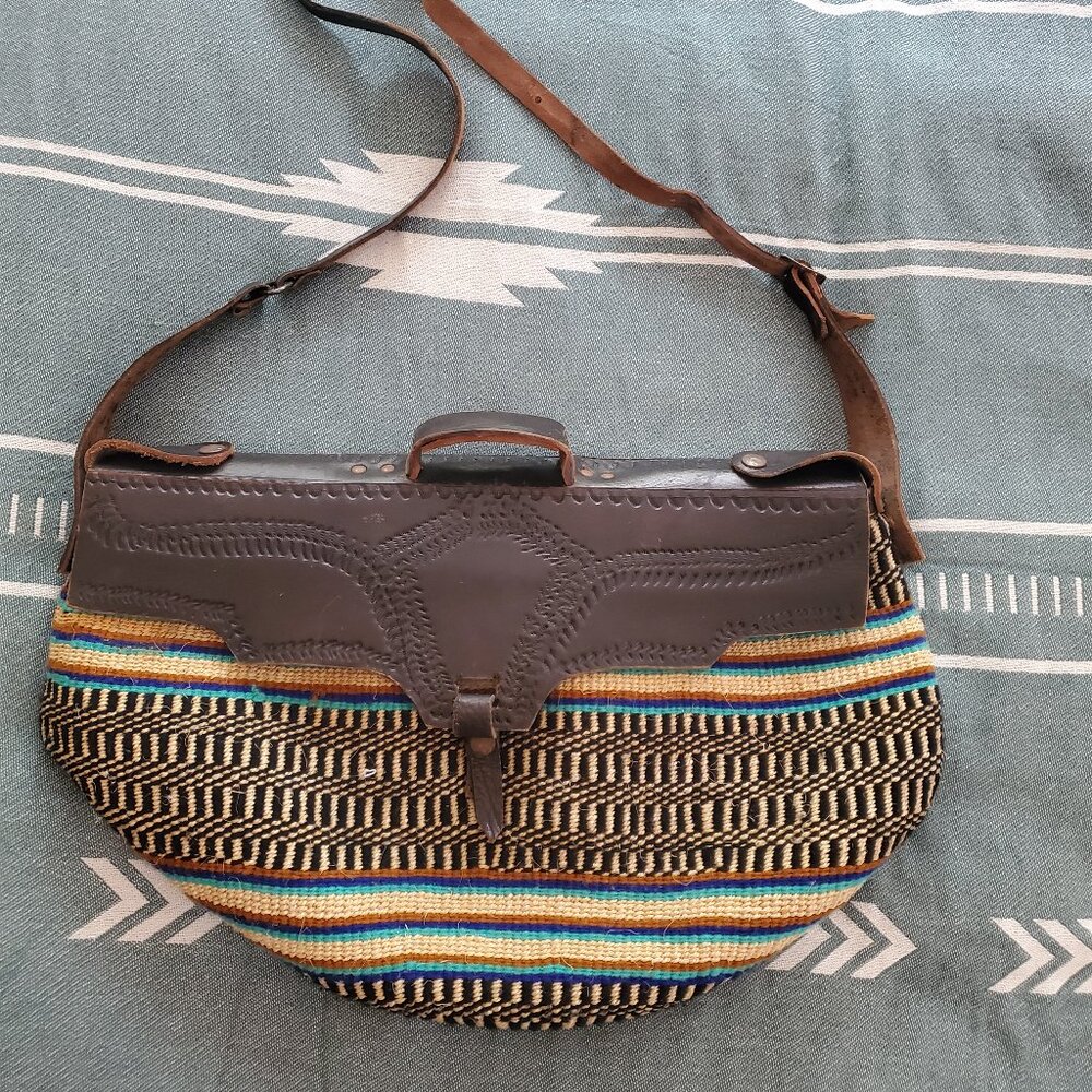 Large Vintage Sisal bag with leather shoulder strap and front closure.